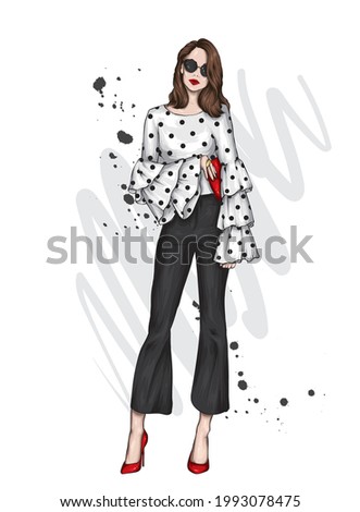 Beautiful high in pants and a shirt. Stylish clothes and accessories. Fashionable woman. Vector illustration. Fashion and Style. Fashion look.  Royalty-Free Stock Photo #1993078475