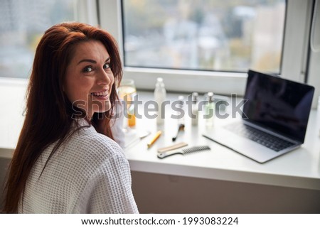 Portrait of pleased woman that doing morning procedure
