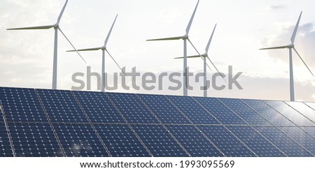 green energy or clean energy concept, 
solar panels and wind turbines generation equipment in the light of the rising sun Royalty-Free Stock Photo #1993095569