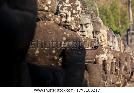 Angkor Thom is a famous bridge over a moat that protected the ancient Baylon Society. This bridge is famous for its iconic body and face sculptures that lead you to the North gate.
