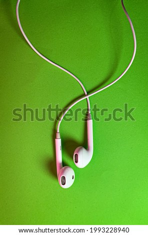 white headset with green background