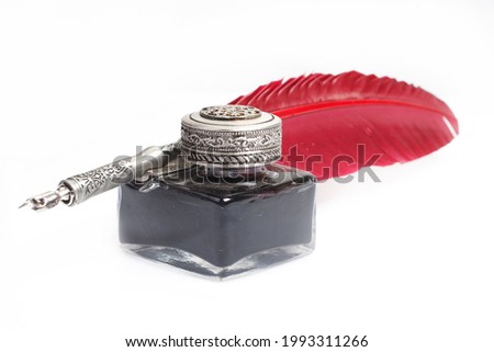 Old vintage red fountain pen with inkwell on white background Royalty-Free Stock Photo #1993311266