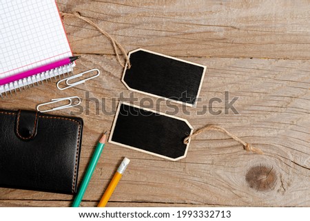 Collection of Real Blank Empty Sticker Card Tag With An Elastic Band On A Different Color Background Containing Modern Gadget Checklist For Labeling Informative Content Purposes