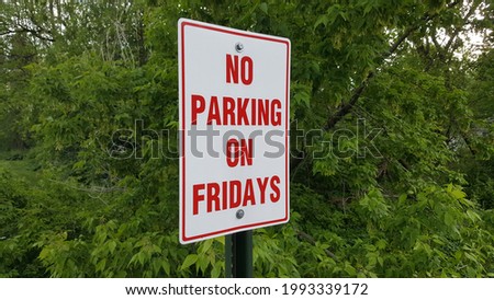 No Parking Sign Says No Parking on Fridays
