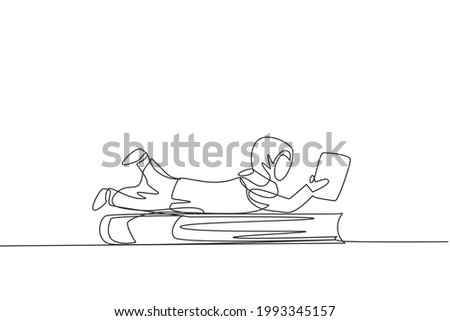 Single one line drawing Arab little girl reading, learning and laying down on big book. Study at home. Smart student, education concept. Modern continuous line draw design graphic vector illustration