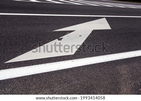 white markings on the road to ensure the safety and regulation of the movement of cars, part of a complex system of traffic regulation that ensures safety on the road
