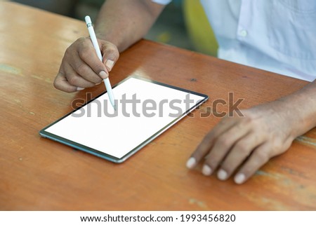 Mockup image blank white screen tablet on wooden table. background empty space for advertise text. people contact marketing business and technology
