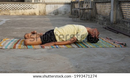 young man doing yoga in the morning.
