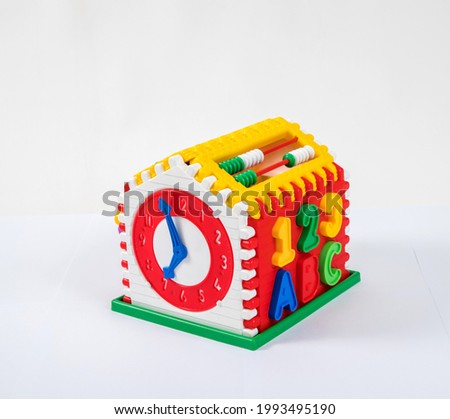 Children's multi-colored plastic toy constructor watch on a white background.