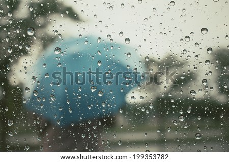 Water drop and blurred umbrella 