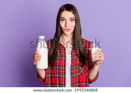 Photo of cute brunette hairdo millennial lady drink milk wear red shirt isolated on purple color background