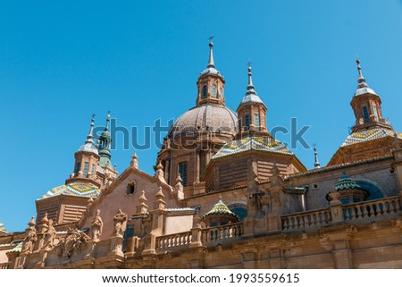 Picture of "Nuestra señora del Pilar" basilica in front of Ebro river captured during a sunny day. Zaragoza, Aragón, Spain.