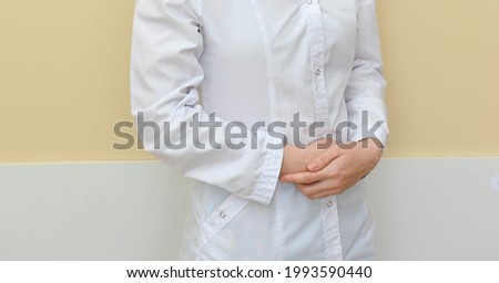 doctor or nurse in a white medical coat 
