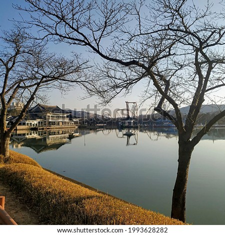 beautiful scenery of lake in autumn season with view of traditional house of korean. Perfect for your android or iPhone wallpaper or just for your persentation and assignment