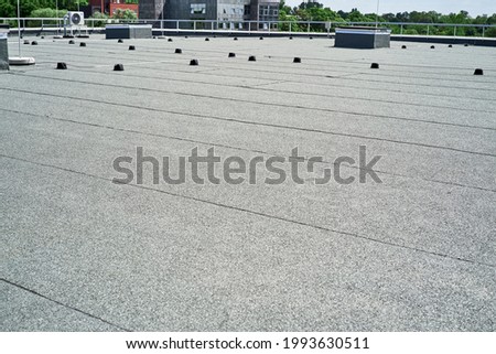 Flat roof protective covering with bitumen membrane for waterproofing Royalty-Free Stock Photo #1993630511