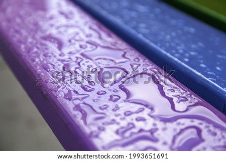 Detail of painted wood wet from rain Royalty-Free Stock Photo #1993651691