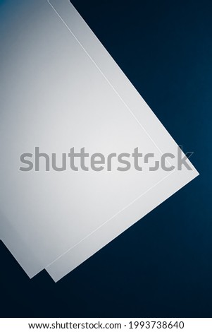 Blank A4 paper, white on blue background as office stationery flatlay, luxury branding flat lay and brand identity design for mockup.