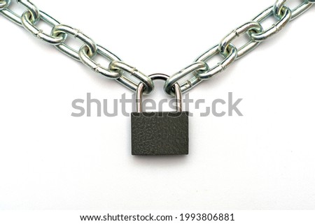 padlock hanging on a chain on a white background. High quality photo