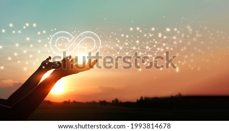 Businessman hold circular economy icon. Sustainable strategy approach to eliminate waste and pollution for future growth of business and environment, design to reuse and renewable material resources.  Royalty-Free Stock Photo #1993814678