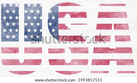 Picture of a painted flag of America on a white wooden board. Text USA. Independence Day.