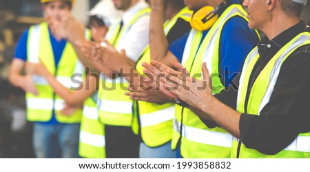 Unity and teamwork concept. team standing hands together. Professional Mechanical Engineer team Working at Second-hand spare parts of old car parts warehouse store. Celebrate clapping Royalty-Free Stock Photo #1993858832