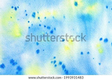 bright light blue, yellow watercolor background on paper