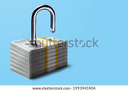 Financial freedom concept. Padlock on stacks of 100 US Dollar bill, Ideas for Debt-free, Unlocking business financial, Liquidity, Business loan, Saving and investing money, Security deposit, Start-up Royalty-Free Stock Photo #1993945904