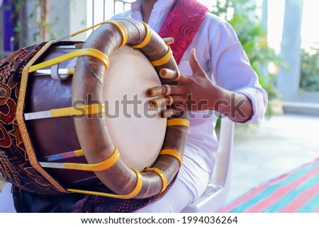 Thavil a traditional barrel shaped musical instrument used in folk and Carnatic music