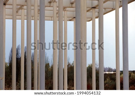columns holding the canopy of the entrance to the park.