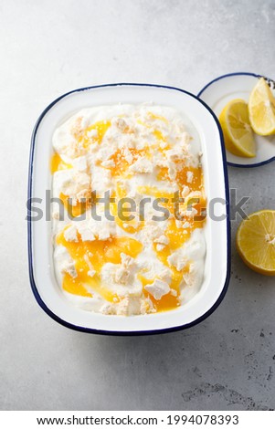 Homemade elderflower ice cream with meringue and lemon curd