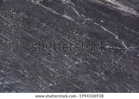 Marble background with aged stripes in black and white