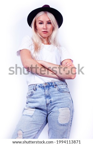 young pretty blond girl hipster in hat on white background casual close up dreaming smiling posing cheerful, lifestyle people concept