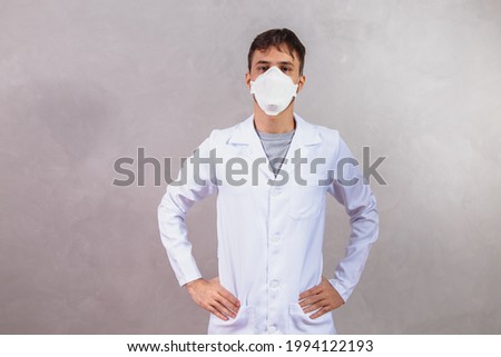 photo of nurse on gray background with protective mask