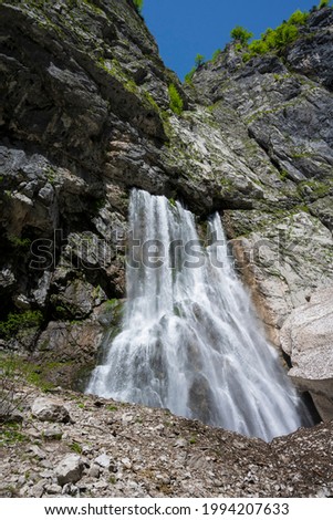 Geghsky waterfall in the mountains of the Republic of Abkhazia. Clear sunny day May 14, 2021