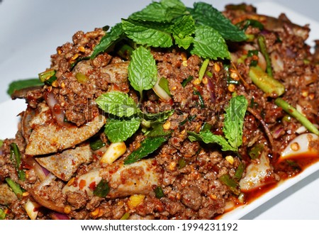A traditional Thai dish is called Larb in Thai name (minced meat with mint, chili, and herbs).It is a spicy and very delicious meal.