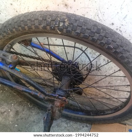 part of vehicle .This is bicycle tire with chain.The color  is black 