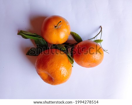 Orange, Pakistani fruit. Beautiful Orange fruit with peels. Close-up picture of orange. Pakistani food. Ripe and fresh orange fruits on isolated white background. Landscape image. Top view. Close-up