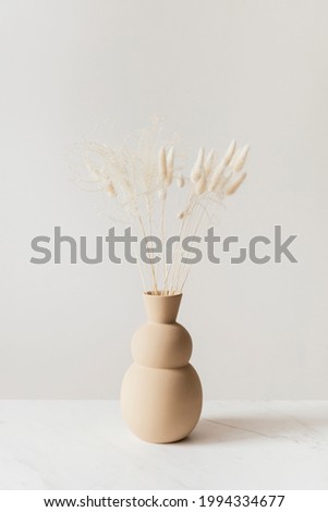 Dried Bunny Tail grass in abrown vase