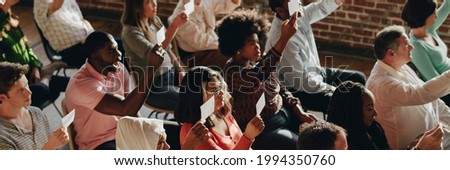 Group of diverse voters showing ballots Royalty-Free Stock Photo #1994350760