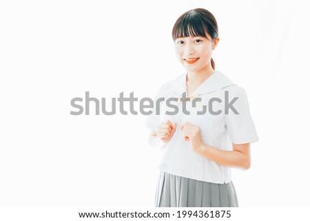 Smiling young school girl in uniform