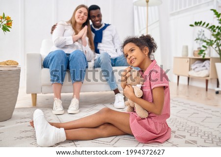 Happy family resting in living room