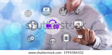 Man touching an e-commerce concept on a touch screen with his finger