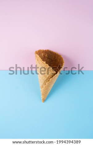 Empty ice-cream basket on colored background, top view. 