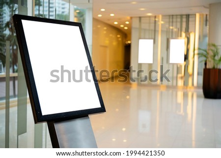Billboard mock up inside the hotel building near reception area. Template of an interior empty information billboard, Mock-up of a city banner placeholder and poster. Royalty-Free Stock Photo #1994421350