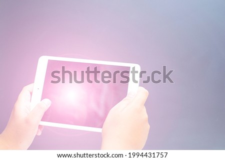 hand holding modern learning education equipment on gray background