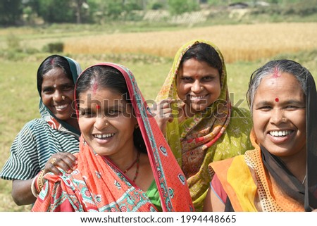 Four Indian women are doing their work in agriculture field for their livelihood Royalty-Free Stock Photo #1994448665