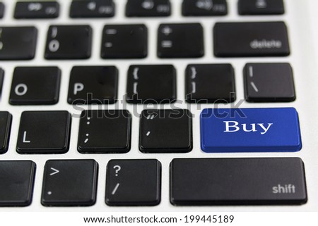 computer keyboard enter button with text Buy