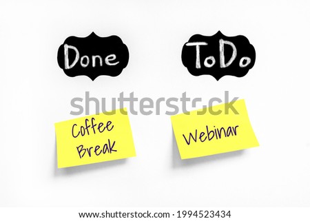 Two Yellow stickers with Coffee Break and Webinar text on white Whatman paper. Chalk text Done, ToDo on black labels. Concept learn, starting education. Handwriting text close up, copy space Royalty-Free Stock Photo #1994523434