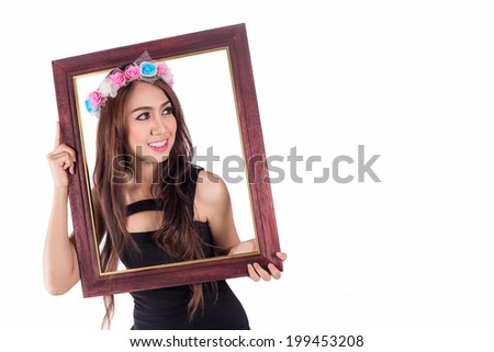 Woman with picture frame on white, Smiling asian women on black dress look to right