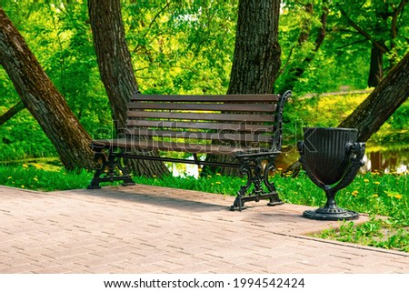 wooden bench for relaxing in the park in summer